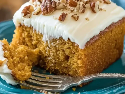 slice of moist pumpkin cake recipe with cream cheese frosting
